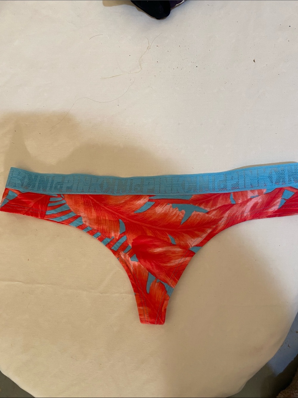 PINK Victoria's Secret Red Tropical Print Thong with Blue Waistband